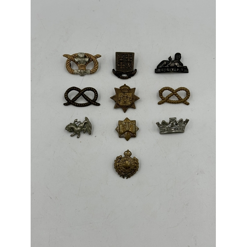 2239 - Ten military cap badges