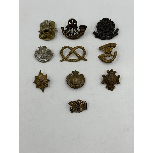 2240 - Ten military cap badges