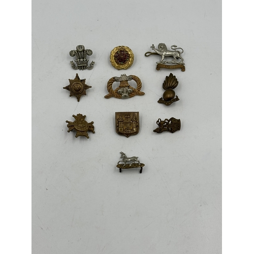 2241 - Ten military cap badges