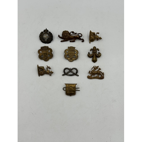 2244 - Ten military cap badges