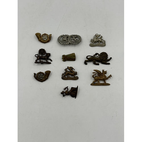 2245 - Ten military cap badges