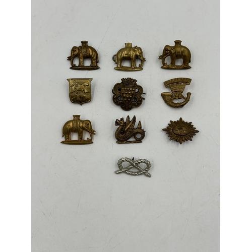 2246 - Ten military cap badges