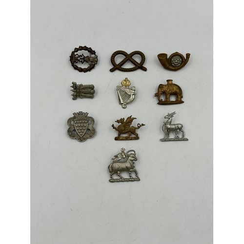 2248 - Ten military cap badges