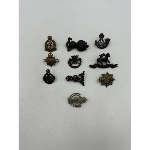 2253 - Ten military cap badges