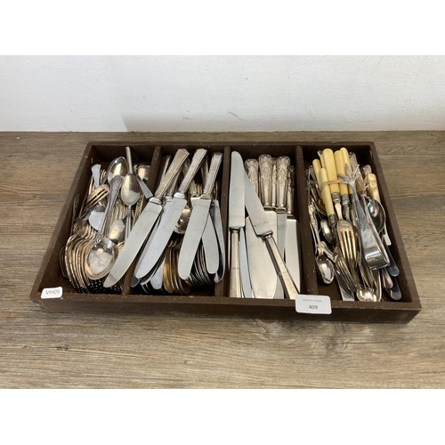 409 - A large collection of antique and later cutlery to include Kings pattern etc.