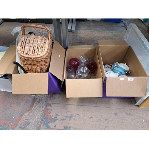 1038 - Six boxes containing Crown Staffordshire bone china, glassware, wicker basket, Merry Christmas windo... 