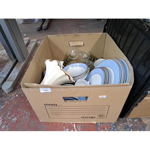 1044 - A box containing ceramics and glassware to include Royal Doulton etc.