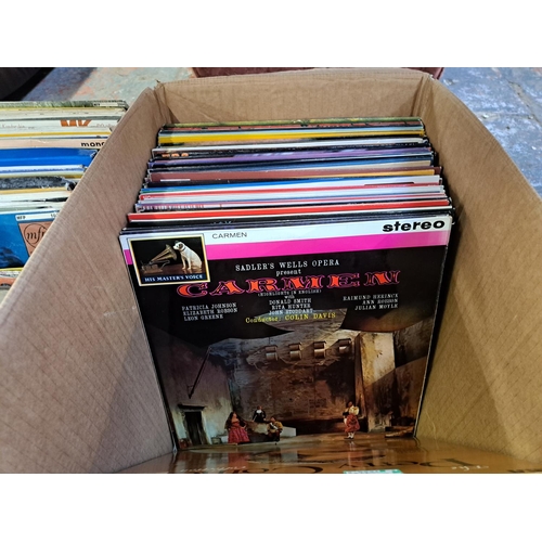 1048 - Three boxes containing vinyl records, cassettes etc.