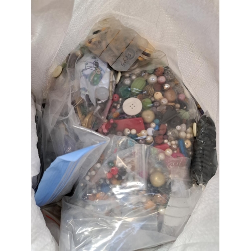 997 - A bag containing a large quantity of buttons and jewellery making accessories