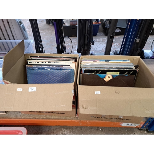 777 - Two boxes containing a collection of vinyl records to include Bob Dylan, Gary Moore, Eric Clapton, S... 