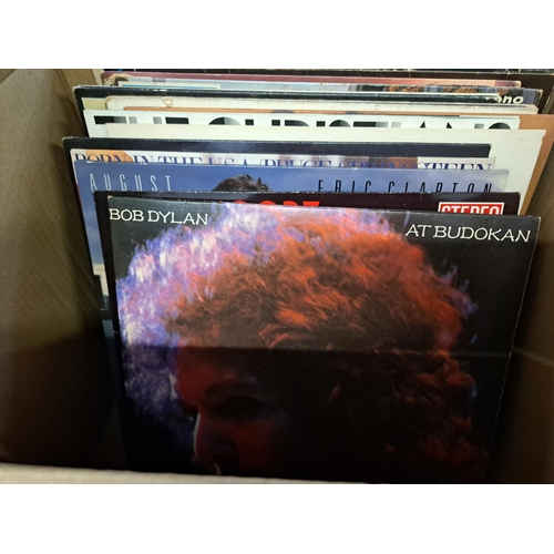 777 - Two boxes containing a collection of vinyl records to include Bob Dylan, Gary Moore, Eric Clapton, S... 