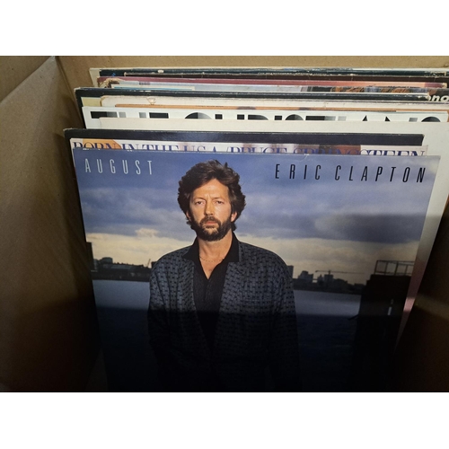 777 - Two boxes containing a collection of vinyl records to include Bob Dylan, Gary Moore, Eric Clapton, S... 