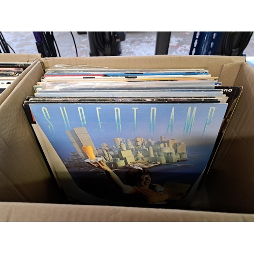 777 - Two boxes containing a collection of vinyl records to include Bob Dylan, Gary Moore, Eric Clapton, S... 