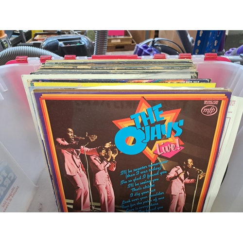 779 - A collection of vinyl records to include Jimmy Cliff, Rick Astley, Cat Stevens, Sade, Diana Ross, Th... 