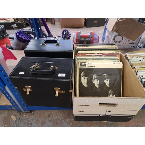 780 - Two record cases and one box containing The Beatles, The Who, David Bowie, Madness, The Police, Roxy... 