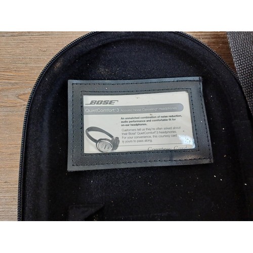 691 - A cased pair of Bose QuietComfort3 noise cancelling headphones