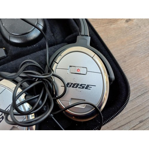 691 - A cased pair of Bose QuietComfort3 noise cancelling headphones