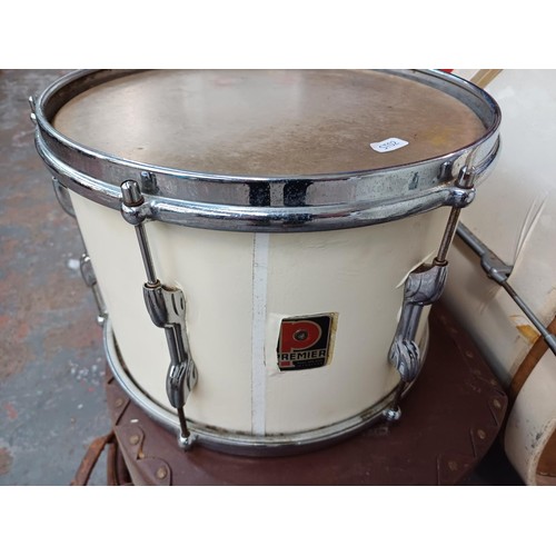 800 - A vintage drum kit comprising Premier snare with flush base stand, Olympic bass drum with Premier pe... 