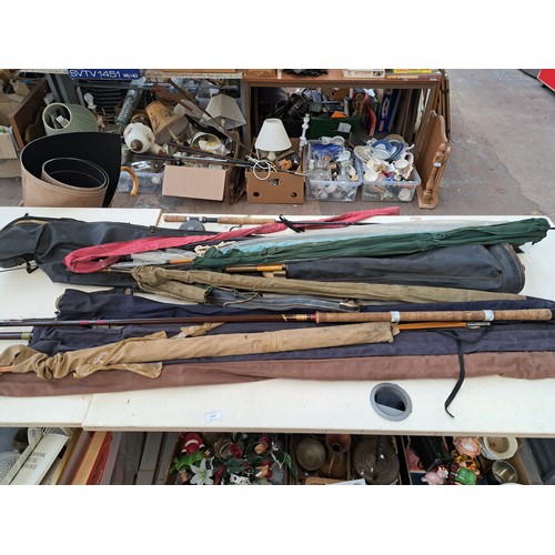 870 - A collection of fishing accessories to include Shakespeare Radial Carbon 1728-300 3m spinning rod et... 