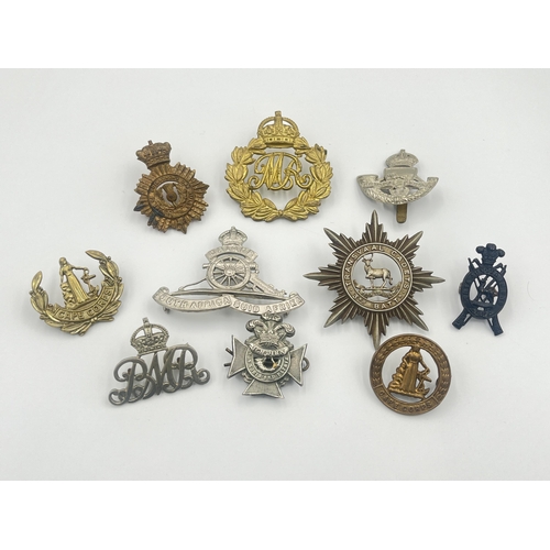 2001 - Ten military cap badges