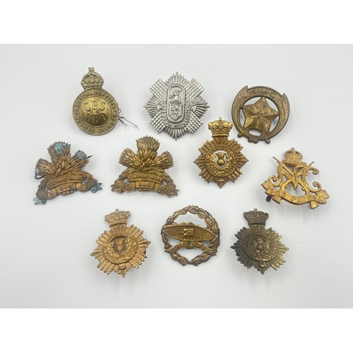 2004 - Ten military cap badges