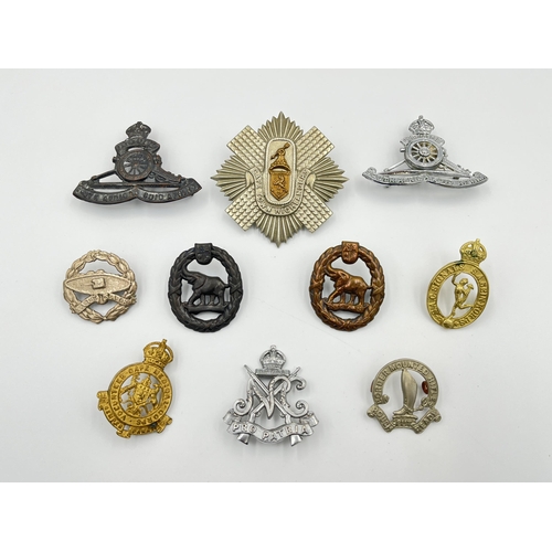 2011 - Ten military cap badges