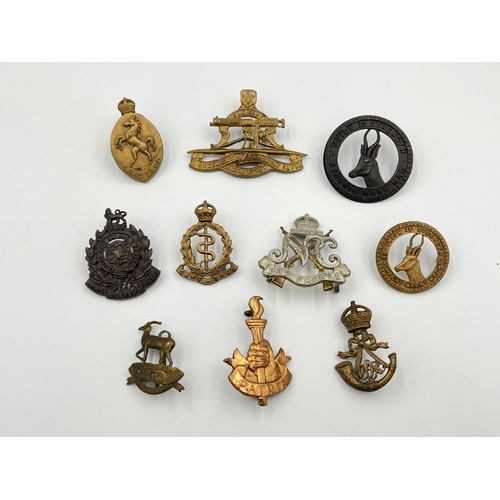 2014 - Ten military cap badges