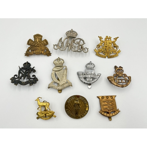 2015 - Ten military cap badges