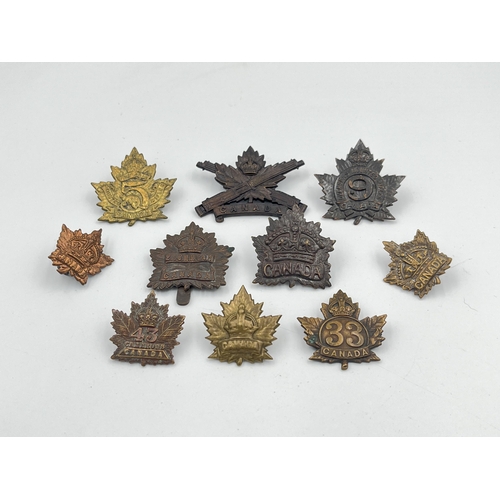 2027 - Ten military cap badges