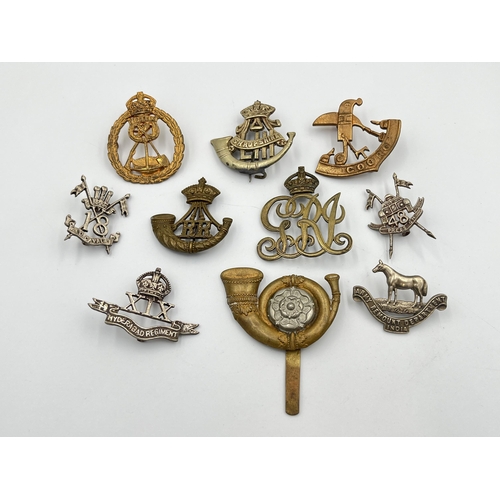 2037 - Ten military cap badges