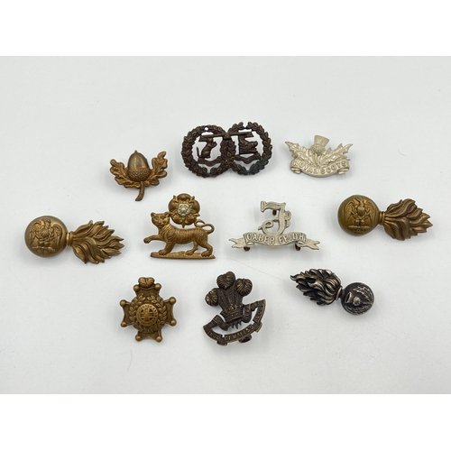 2041 - Ten military cap badges