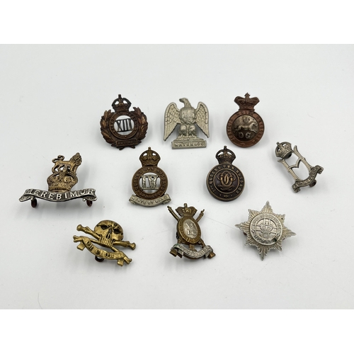 2042 - Ten military cap badges