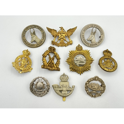 2044 - Ten military cap badges