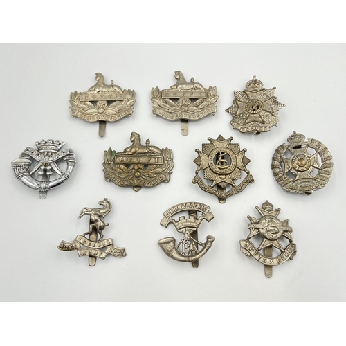 2045 - Ten military cap badges