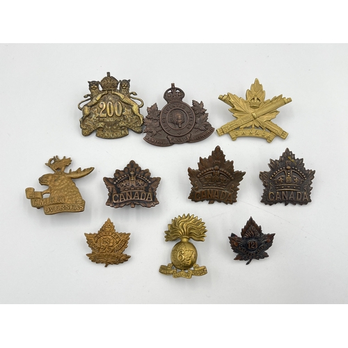 2046 - Ten military cap badges