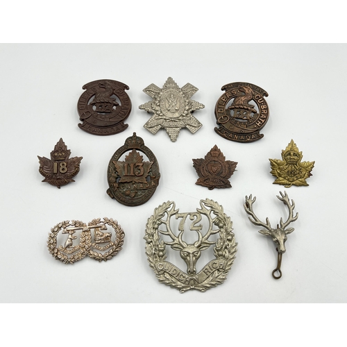 2047 - Ten military cap badges