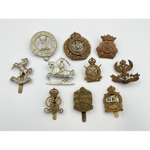 2049 - Ten military cap badges