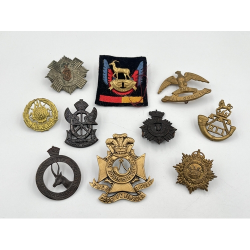 2051 - Ten military cap badges