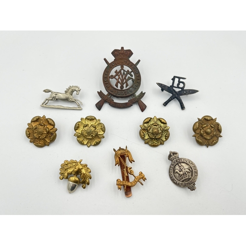 2052 - Ten military cap badges