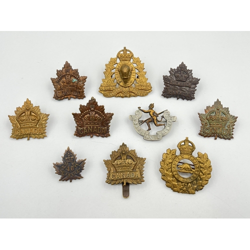 2054 - Ten military cap badges