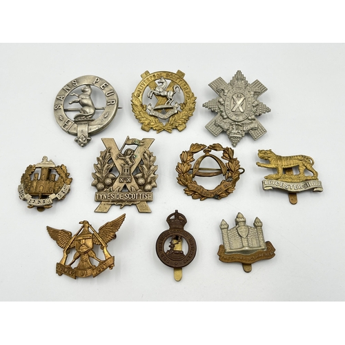 2055 - Ten military cap badges