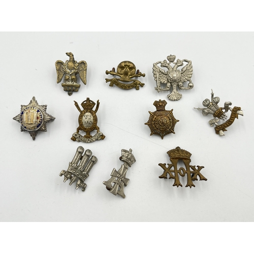 2056 - Ten military cap badges