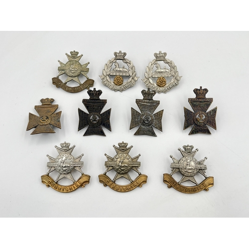 2058 - Ten military cap badges