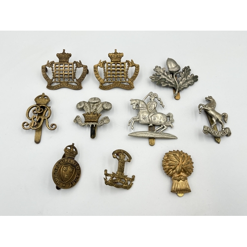 2060 - Ten military cap badges