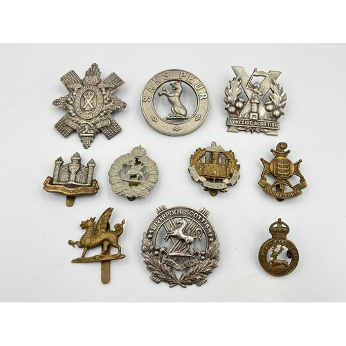 2063 - Ten military cap badges