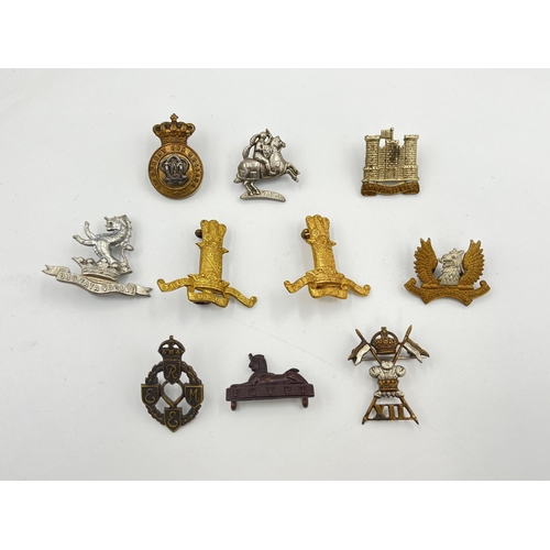 2064 - Ten military cap badges