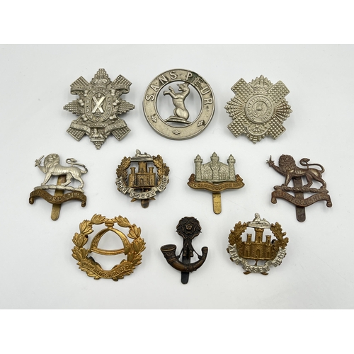 2066 - Ten military cap badges