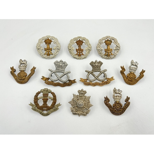 2067 - Ten military cap badges