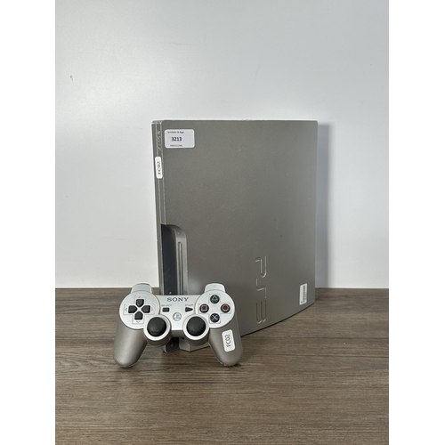 730 - A Sony PlayStation 3 CECH-3002B limited edition 320 GB silver console with DualShock 3 controller