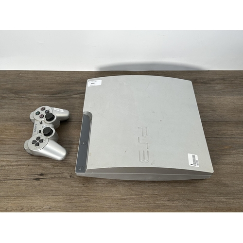 730 - A Sony PlayStation 3 CECH-3002B limited edition 320 GB silver console with DualShock 3 controller